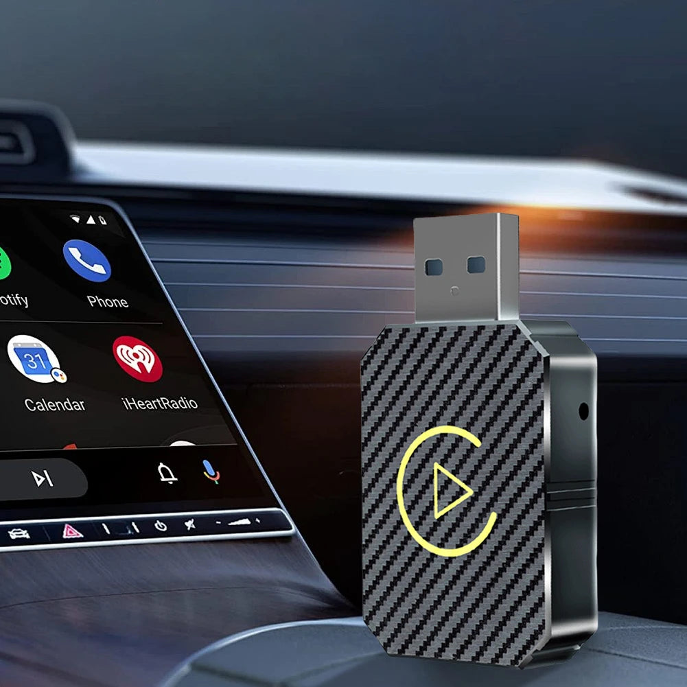 wireless CarPlay Android Auto adapter displayed in a car with carbon fiber pattern design.